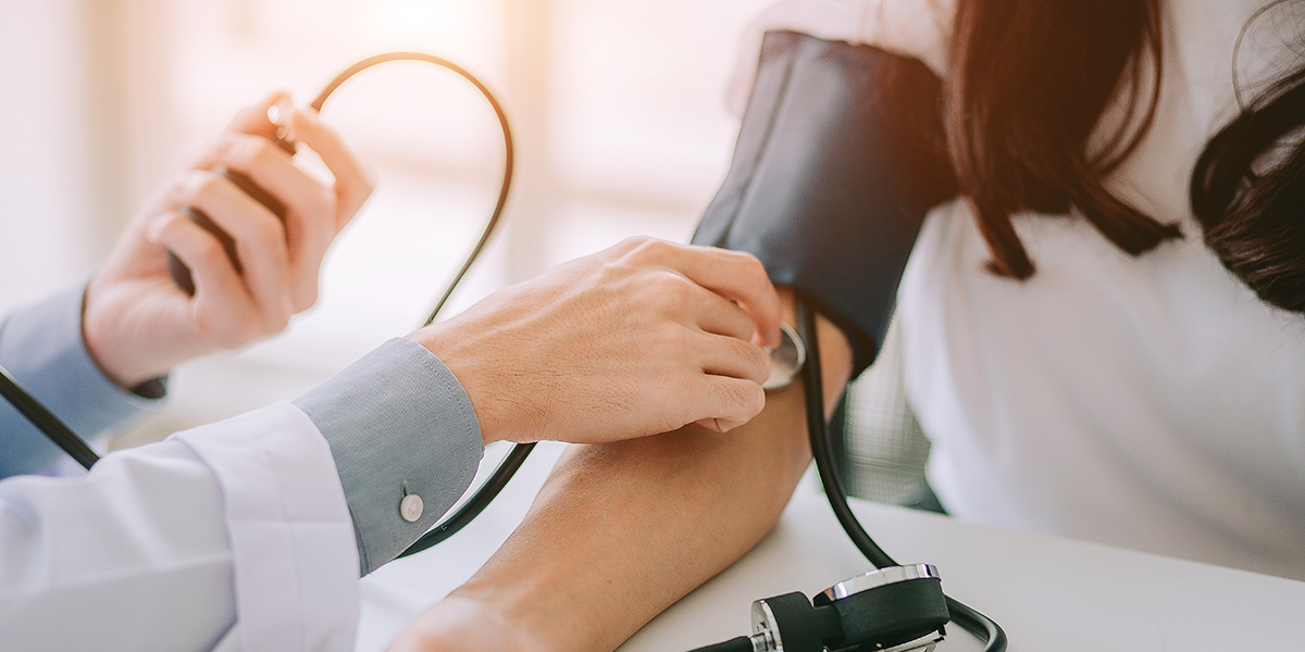 Person getting blood pressure checked